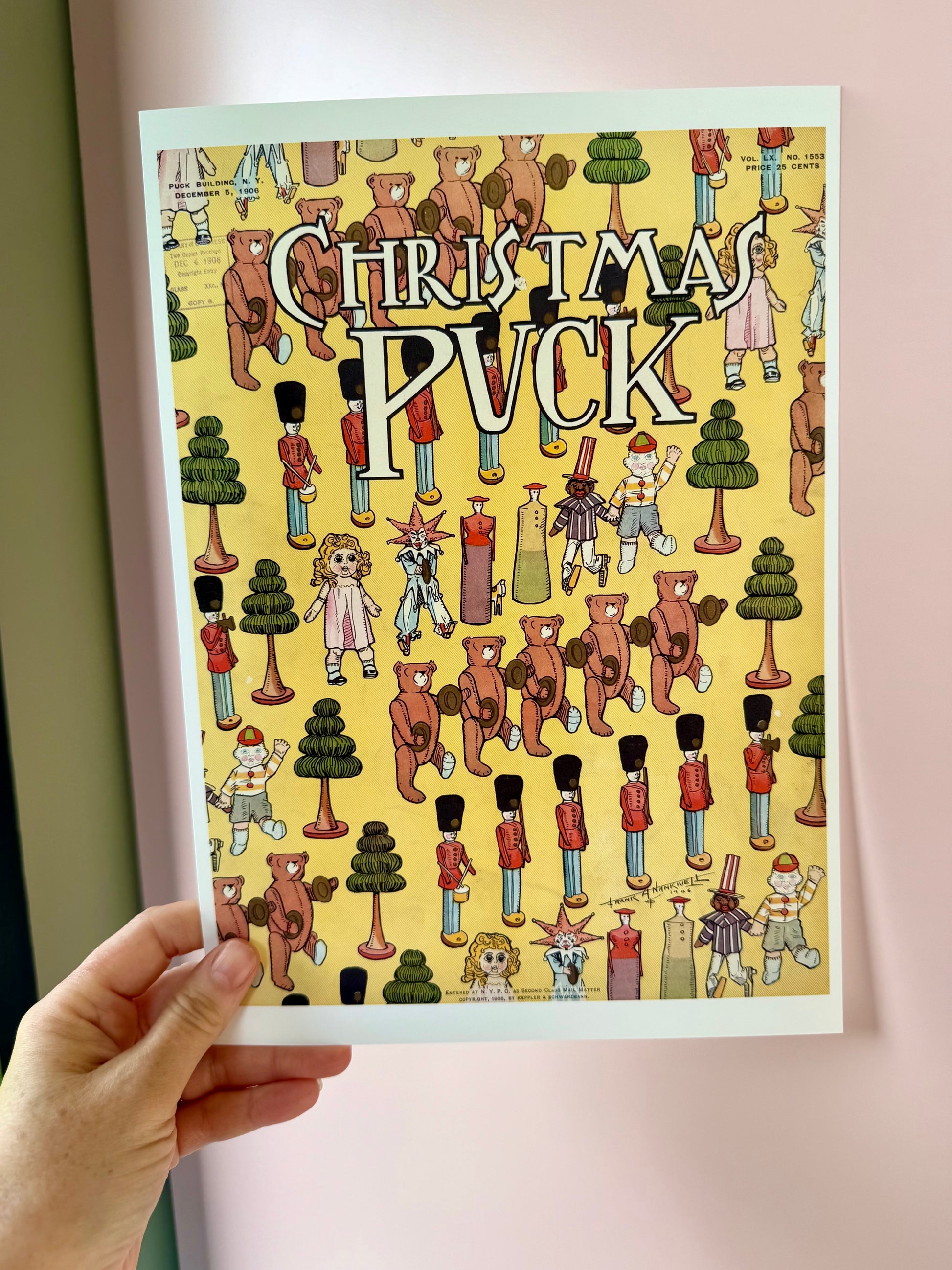 Poster with 'Christmas Puck' design featuring teddy bears and nutcrackers held by a hand.